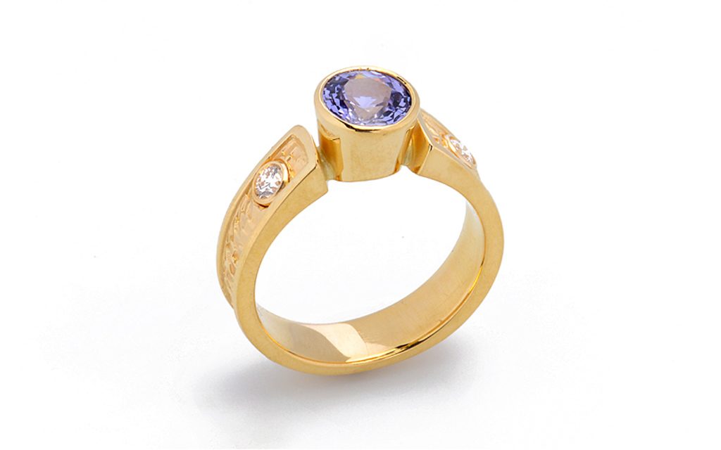 8012R - 18 karat yellow gold ring set with a 1.54ct. un-treated Color change Sapphire and .20cttw. Diamonds (8.4g) Price Upon Request