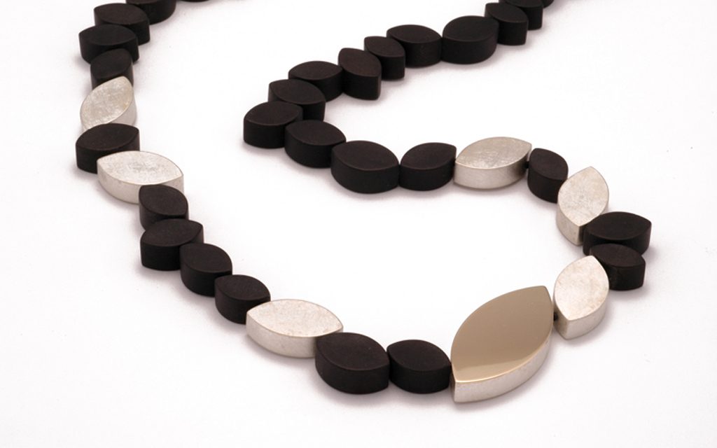 8086N - 24" long necklace with black Onyx, sterling Silver and 14 karat gold (3.2g) Price Upon Request