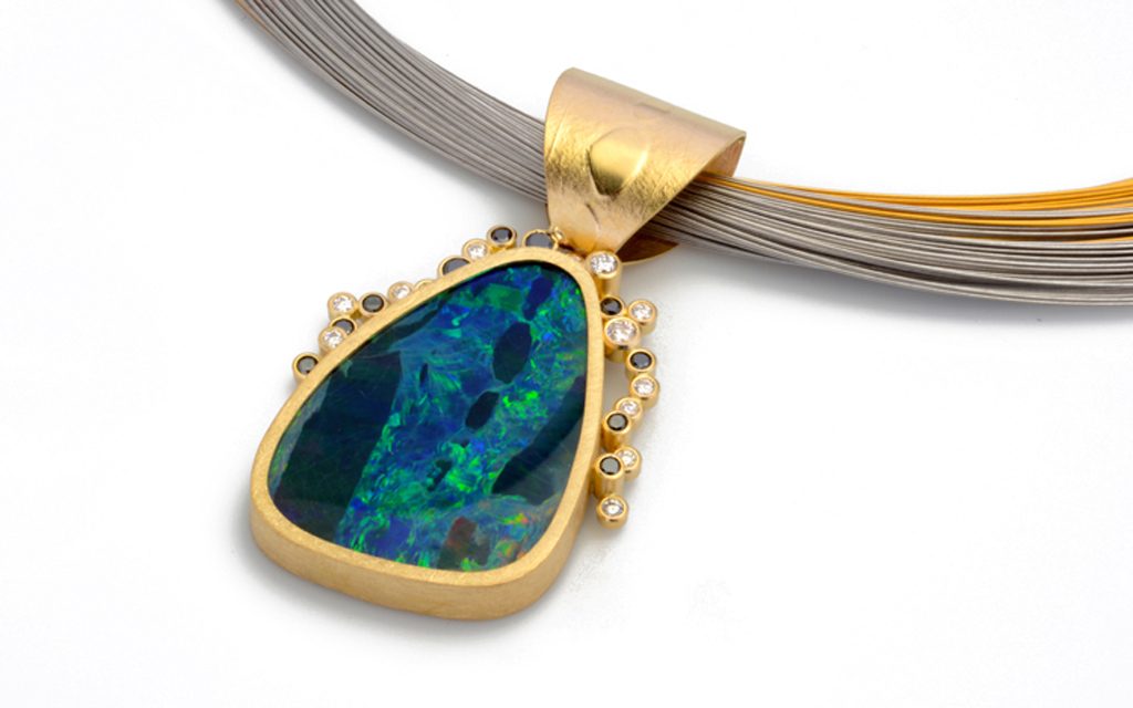 8109N - 18 karat yellow gold necklace set with a 20.26ct. Boulder Opal Doublet and .60cttw. White and Black Diamonds (7.7g) Price Upon Request