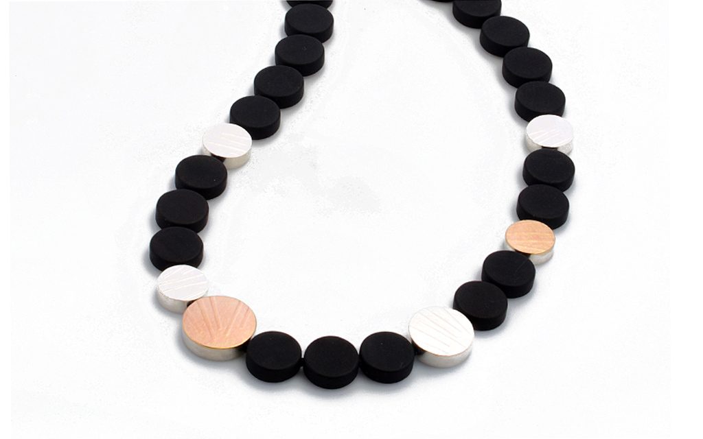 8112N - 14 karat gold, Sterling Silver and Onyx necklace. 17" in length Price Upon Request